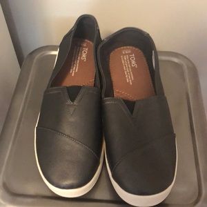 Never worn Toms 9.5 size slip ons